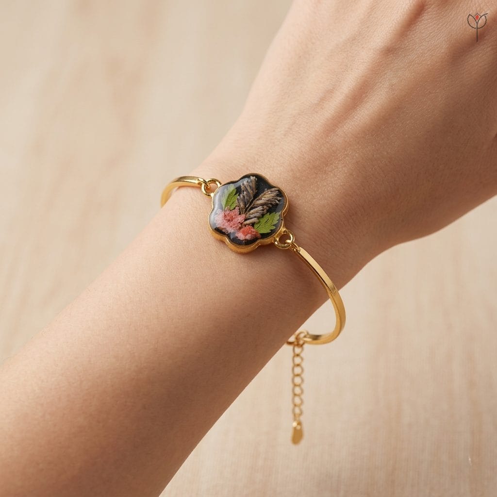 gold-bangle-botanical-fern-statice Handcrafted gold bangle featuring real preserved fern and statice in resin
