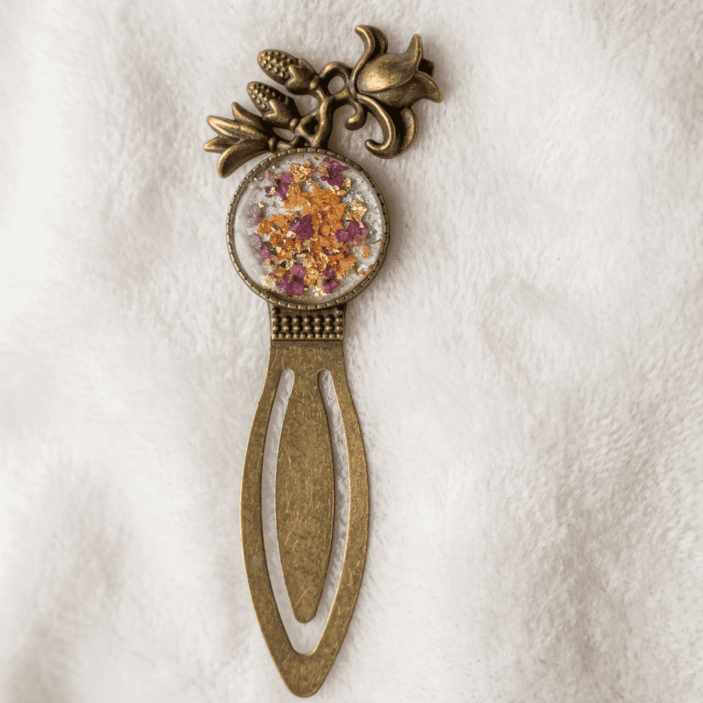 Close-up of a crowned boho bookmark with a floral resin center