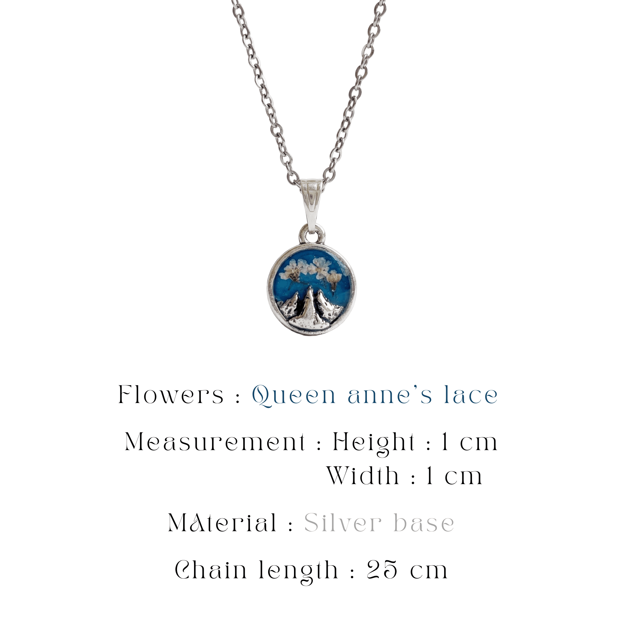 Close up of a handcrafted botanical pendant on a silver chain