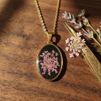 Midnight Petal Orbit Pendant with purple flower in dark resin