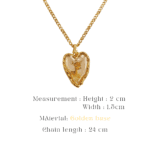 Gold-toned heart pendant with a deer motif and pigment resin