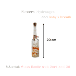Preserved flower bottle with star charm and red twine