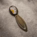 Obsidian Orchid bookmark with a real white daisy in resin