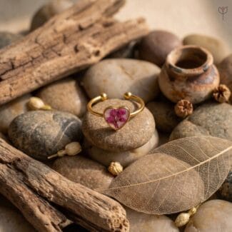 Real pink Baby's breath flower preserved in a heart-shaped resin ring