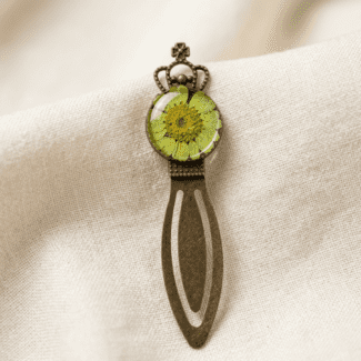 Royal Greenery bookmark with a real green daisy in a bronze crown frame