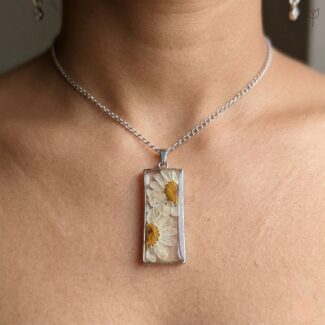 Handmade silver necklace featuring the Dewy Daisy Pendant