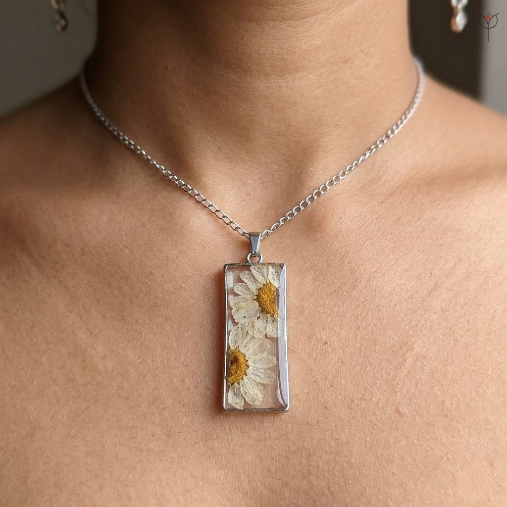 Handmade silver necklace featuring the Dewy Daisy Pendant