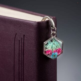 Handcrafted silver hook bookmark with real pink and turquoise flowers in resin