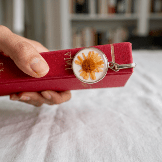 Solar Swirl bookmark with a real orange Aster in a silver hook