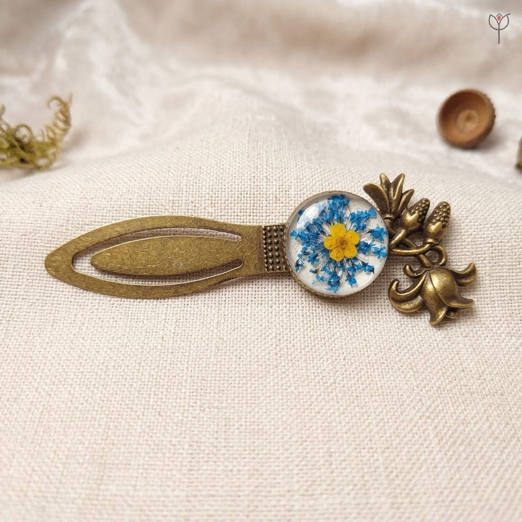 vintage-blue-sunburst-crowned-book-marker Close-up of Sapphire Sun bookmark showing the ornate bronze tulip crown
