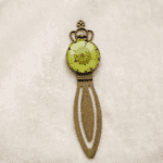 Close-up of the Royal Greenery bookmark showing the green petals and crown