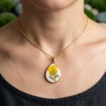 Handcrafted gold necklace featuring the Sunny Aura Pendant