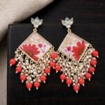 Kaira Kundan Jhumka featuring kundan-studded tops and real red daisies