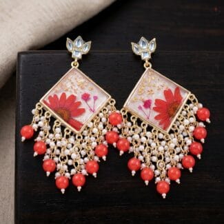 Kaira Kundan Jhumka featuring kundan-studded tops and real red daisies