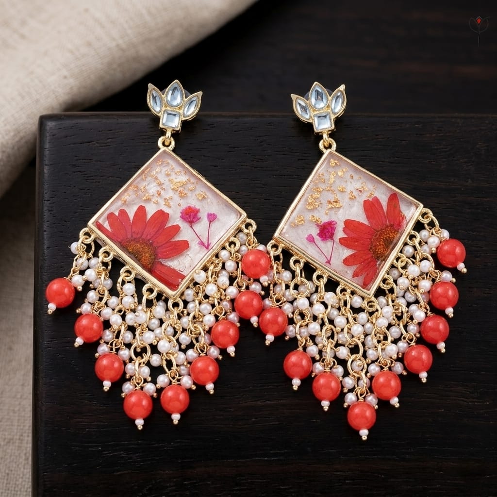 kaira-kundan-jhumka-daisy-floral-jewelry Kaira Kundan Jhumka featuring kundan-studded tops and real red daisies