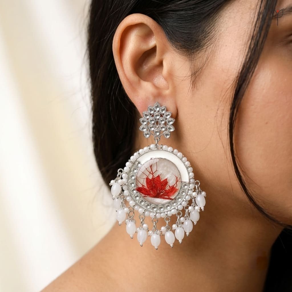 frost-lily-resin-jhumka-model-wearing-earrings Model wearing Frost Lily Resin Jhumka - silver kundan earrings with pearl tassels