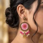Model wearing Gilded Daisy Jhumka - pink daisy earrings with pearl tassels