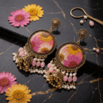 Rosy Daisy Meadow Jhumka side view with pink kundan beads and pearl tassels