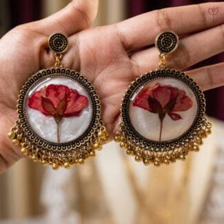 Close-up of real sundried rose flower sealed in resin jhumka