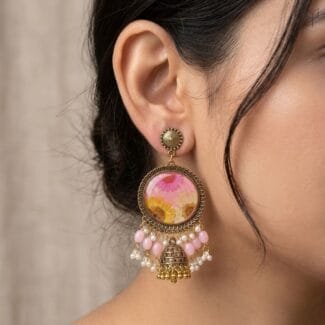 MystikFalls Honey Blush Jhumkas worn by model Antique gold pressed flower resin jhumka earrings showing pearl