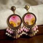 MystikFalls Honey Blush Jhumkas Real pressed golden daisy and pink aster in pink resin with antique gold round frame