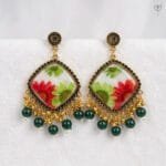 MystikFalls Scarlet Garden Jhumkas Real pressed red aster and green daisy in clear resin with antique gold diamond-shaped frame