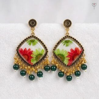 MystikFalls Scarlet Garden Jhumkas Real pressed red aster and green daisy in clear resin with antique gold diamond-shaped frame