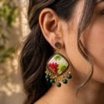 MystikFalls Scarlet Garden Jhumkas worn by model Antique gold pressed flower resin jhumka earrings