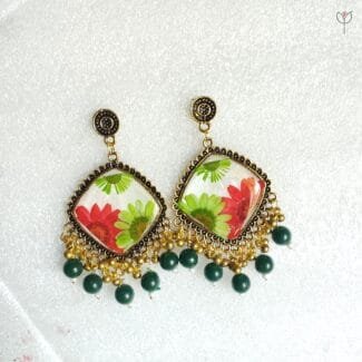 MystikFalls Scarlet Garden Jhumkas close-up Preserved red aster and green daisy petals