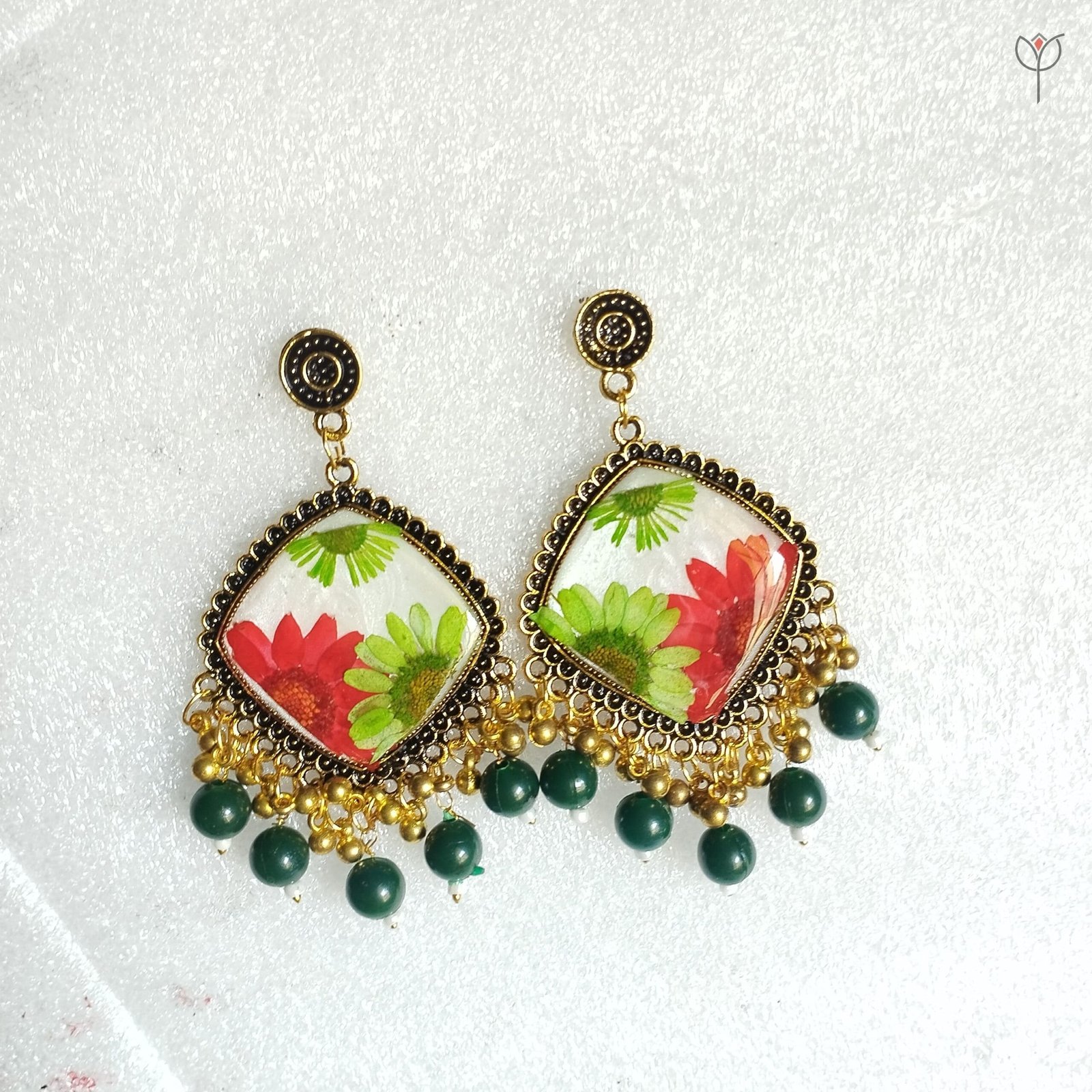 mystikfalls-scarlet-garden-jhumkas-pressed-daisy-aster-resin-earrings MystikFalls Scarlet Garden Jhumkas close-up Preserved red aster and green daisy petals