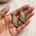 Elara Resin Earrings styled as handcrafted botanical jewellery with real hydrangea flowers preserved in resin set in gold-toned marquise studs