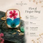 Close-up of pressed plum blossom and hydrangea petals inside resin on the Fae Garden Ring from Mystik Falls