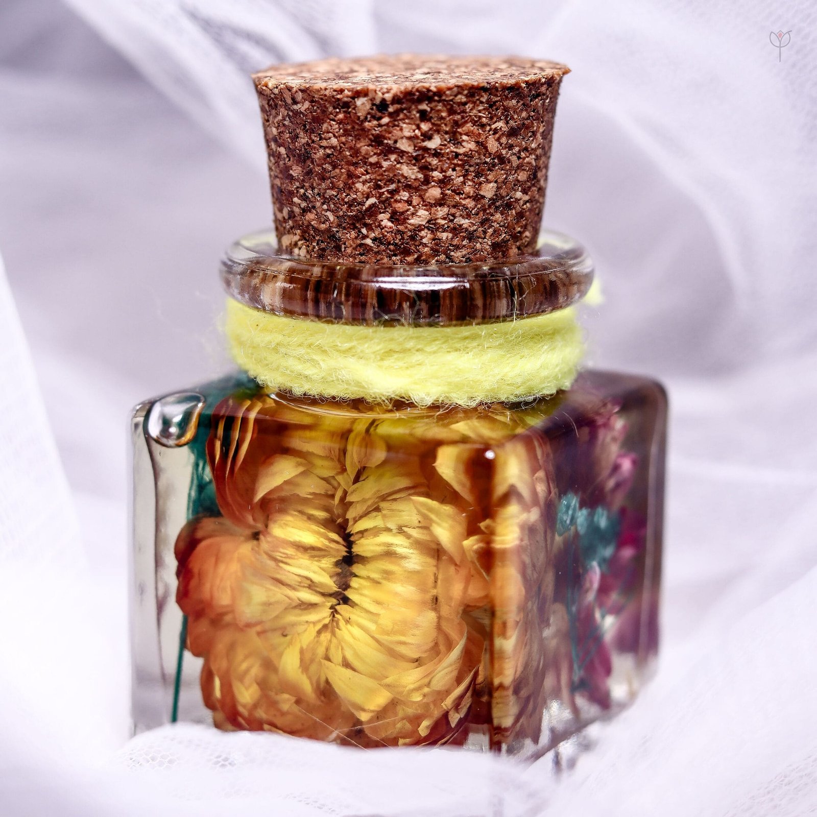 golden-solace-mini-sunflower-glass-garden-rustic-table-decor Golden Solace Mini Sunflower Glass Garden placed as rustic sunflower table decor beside books and candles