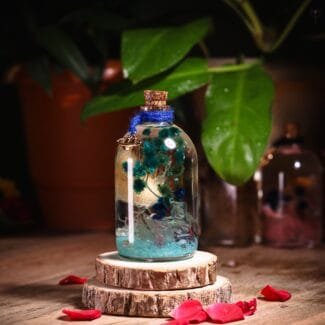 Green Sea Glass Garden with real preserved flowers in mineral oil cork bottle by MystikFalls