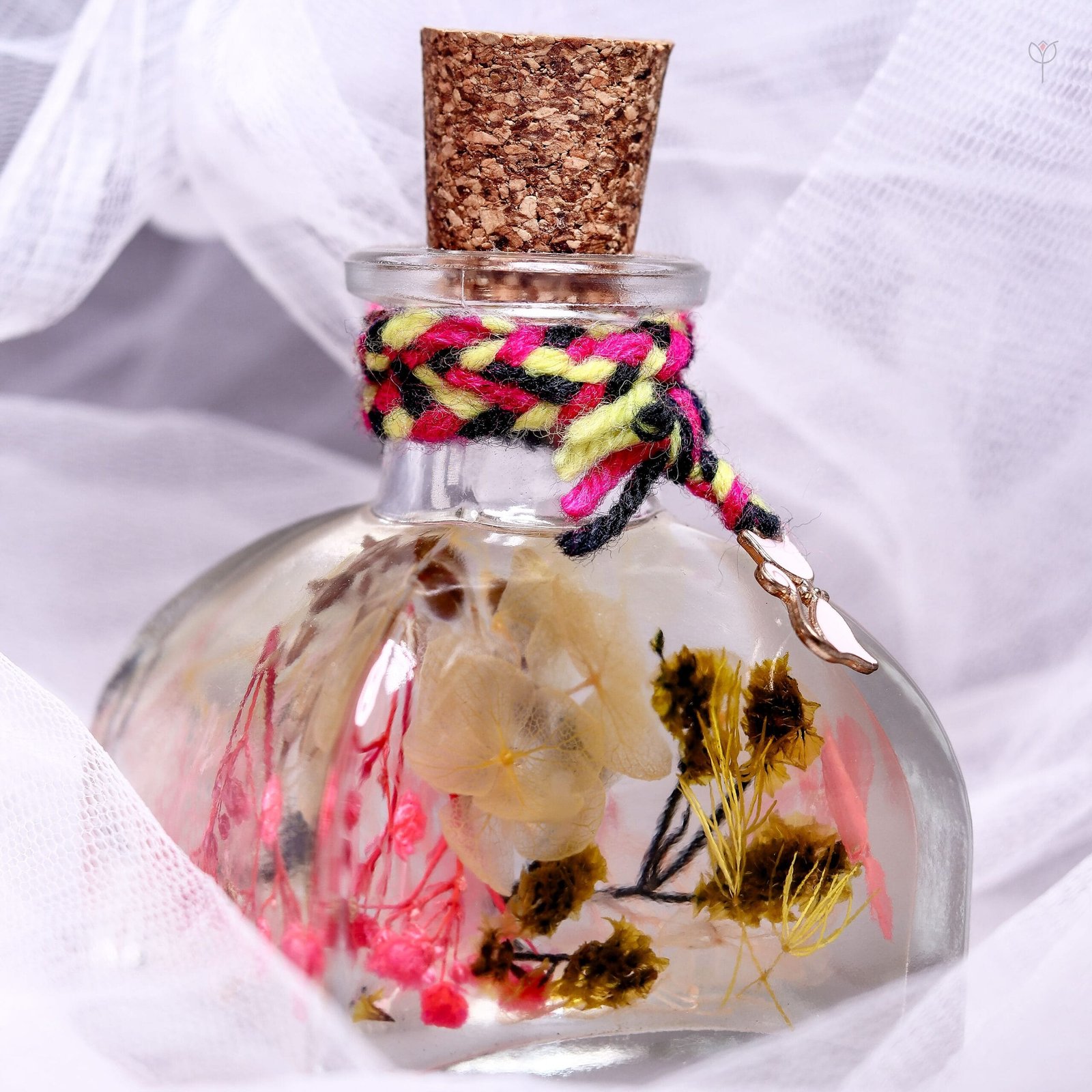 Gypsy Garden Glass Garden displayed as bohemian colourful preserved floral home decor on a wooden log stand
