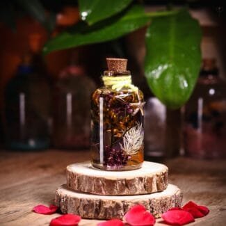 Island Sunset Glass Garden with real preserved warm tone flowers in mineral oil cork bottle by MystikFalls