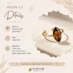 Obsidian Bloom Ring displayed on cream marble surface showing marquise resin setting and gold open band