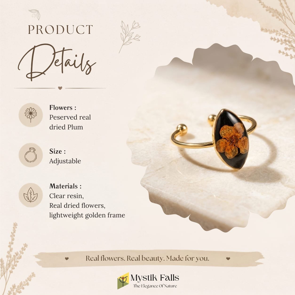 obsidian-bloom-ring-marble-surface-minimal-styling Obsidian Bloom Ring displayed on cream marble surface showing marquise resin setting and gold open band
