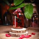 Red Tide Glass Garden with real preserved red leaves and dry flowers in mineral oil cork bottle by MystikFalls