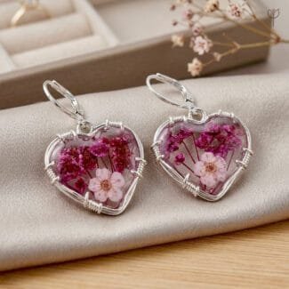 Valentina Bloom Earrings featuring preserved plum flower and baby's breath in a heart-shaped resin pendant with silver wire-wrapped setting by MystikFalls