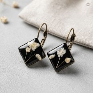 Vesper Resin Earrings featuring preserved white baby's breath in black resin diamond-shaped pendants with antique lever-back hooks by MystikFalls