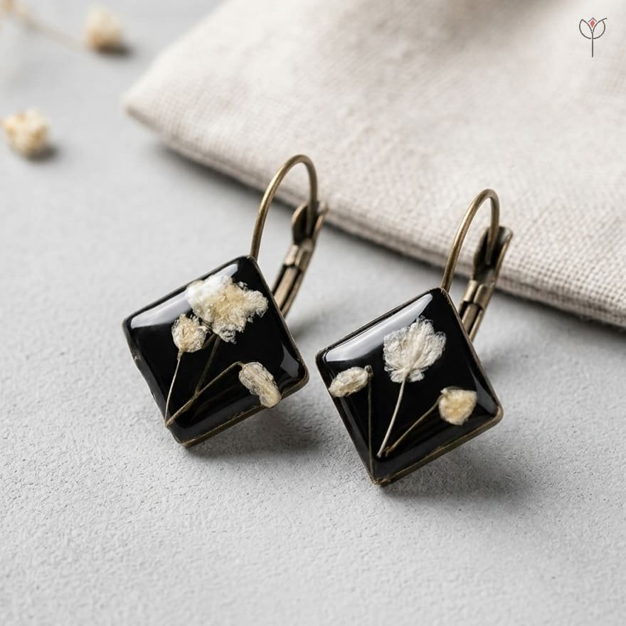 vesper-resin-earrings-white-baby-breath-black-resin-antique-mystikfalls Vesper Resin Earrings featuring preserved white baby's breath in black resin diamond-shaped pendants with antique lever-back hooks by MystikFalls