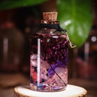 Violet Veil Glass Garden close-up of real preserved plum hydrangea cluster and delicate transparent skeleton leaves in mineral oil
